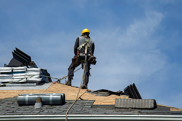 Professional Roofing technician working in Swisshome, OR